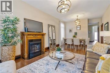 Hamilton apartment for rent - A living room with a fireplace and a television on top of it.