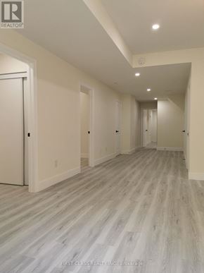 Newmarket (Woodland Hill) apartment for rent - A long hallway with wood flooring and white walls.