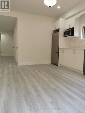 Newmarket (Woodland Hill) apartment for rent - A room with a refrigerator and a microwave built into the cabinetry.