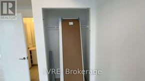 Brampton (Fletcher's Creek South) condo for rent - A room with a door and a sign that says "REALTOR".