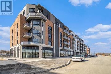 Ottawa condo for rent - A modern apartment building with a car parked in front.