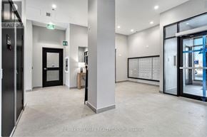 Ottawa condo for rent - A hallway with a glass door and a white door.