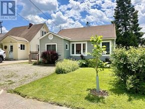 Owen Sound apartment for rent - A house with a tree in front of it.