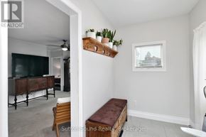 Owen Sound apartment for rent - A living room with a flat screen TV and a bench.
