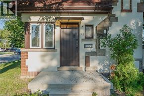 Hamilton apartment for rent - A house with a brown door and a small window above it.