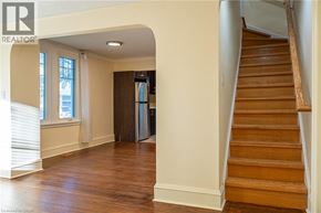 Hamilton apartment for rent - A wooden staircase leads up to a second floor.