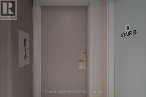 Toronto (Waterfront Communities) condo for rent - A door with a sign that says 6 stair b on the wall.