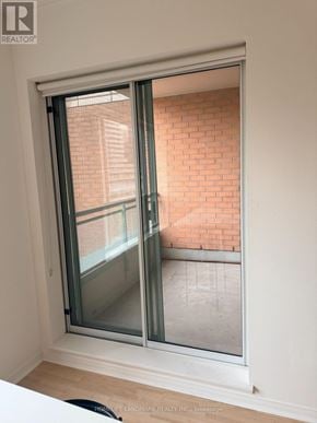 Toronto (Bay Street Corridor) condo for rent - A window with a view of a brick wall.