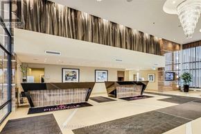 Mississauga (City Centre) condo for rent - A reception area with a black and white checkered floor.