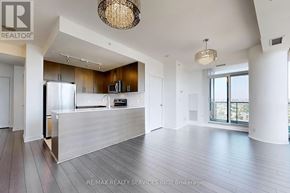Mississauga (City Centre) condo for rent - A spacious living room with a kitchen in the background.