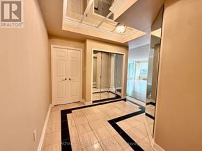 Ottawa condo for rent - A hallway with a black and white striped rug on the floor.