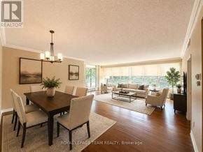 Ottawa condo for rent - A well-lit dining room with a table set for six.