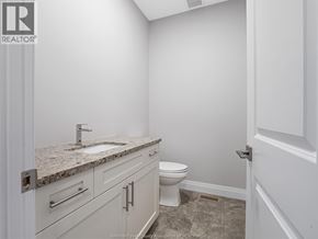 Leamington apartment for rent - A bathroom with a sink, toilet and a tiled floor.