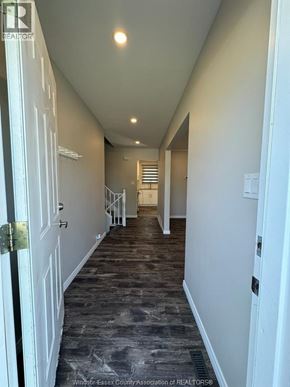 Kingsville apartment for rent - A long hallway with doors on both sides.