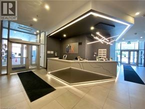 Kitchener condo for rent - A reception area with a desk and a sign that says REALTOR.