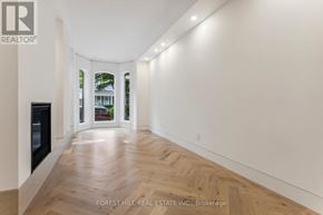 Toronto (Annex) townhouse for rent - A long hallway with wood floors and white walls.