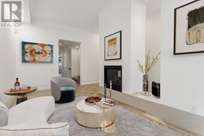 Toronto (Annex) townhouse for rent - A living room with a white couch and a coffee table.