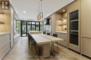 Toronto (Annex) townhouse for rent - A modern kitchen with a dining table and chairs.