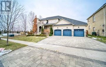 Aurora (Aurora Estates) apartment for rent - A large house with a brick chimney and a driveway in front.