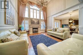 Aurora (Aurora Estates) apartment for rent - A living room with a fireplace and a chandelier.