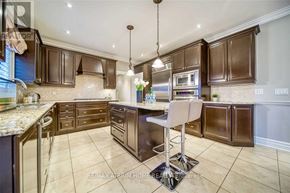 Aurora (Aurora Estates) apartment for rent - A kitchen with brown cabinets and a granite countertop.
