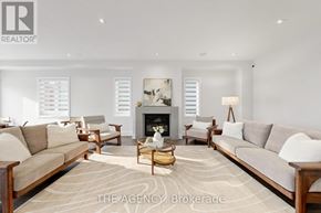 Vaughan (Patterson) apartment for rent - A living room with a fireplace and a painting on the wall.