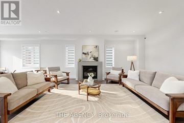 Vaughan (Patterson) apartment for rent - A living room with a fireplace and a painting on the wall.