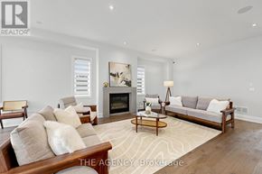 Vaughan (Patterson) apartment for rent - A living room with a fireplace and a couch.