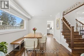 Mississauga (Erin Mills) apartment for rent - A dining room with a wooden table and chairs.