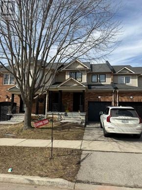 Oakville (Wm Westmount) townhouse for rent - A house with a sign that says "Coming Soon" in front of it.