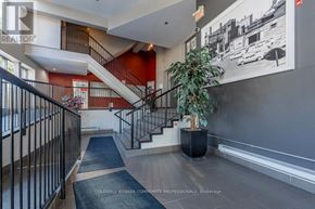 Hamilton (Beasley) condo for rent - A hallway with a staircase and a plant in a planter.