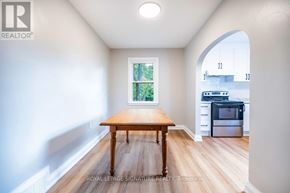 Peterborough (Northcrest Ward 5) apartment for rent - A room with a wooden table and a window.