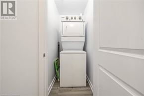 Hamilton (Waterdown) condo for rent - A white oven and toilet in a small room.