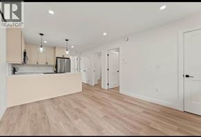 Windsor apartment for rent - A spacious kitchen with light wood flooring and white walls.