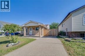 Windsor apartment for rent - A house with a white door and a brown fence is shown.