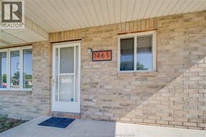 Windsor apartment for rent - A house with a white door and a window with a number 1465 on it.