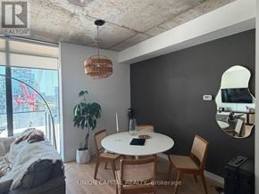 Toronto (Waterfront Communities) condo for rent - A dining room with a round table and chairs.