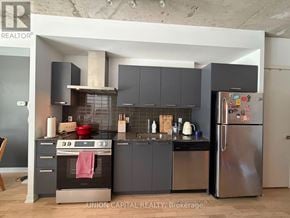 Toronto (Waterfront Communities) condo for rent - A modern kitchen with Union Capital Realty Brokerage logo.