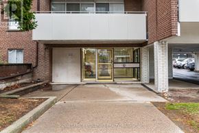 Toronto (Parkwoods-Donalda) condo for rent - A building entrance with a glass door and a sign that says "ROYAL LEPAGE SIGNATURE READY Brokerage".