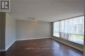 Toronto (Church-Yonge Corridor) condo for rent - A room with wooden floors and a window with blinds.