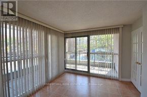 Toronto (Church-Yonge Corridor) condo for rent - A room with a sliding glass door and a tiled floor.