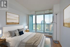 Toronto (Willowdale West) condo for rent - A bedroom with a large bed and a view of the city.