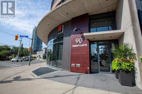 Toronto (Moss Park) condo for rent - The front of a building with the number 90 on it.