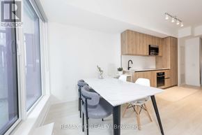 Toronto (Mount Pleasant West) condo for rent - A dining area with a white table and grey chairs.