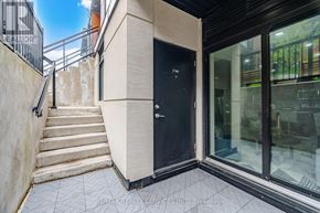 Vaughan (Vaughan Grove) townhouse for rent - A black door is on the side of a building.