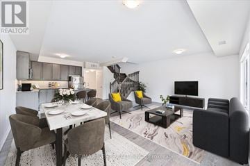 Vaughan (Vellore Village) condo for rent - A modern living room with a dining table set for two.