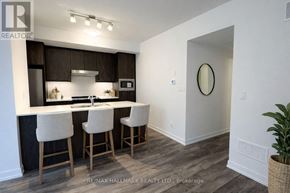 Richmond Hill (Jefferson) townhouse for rent - A kitchen with white chairs and a white counter top.