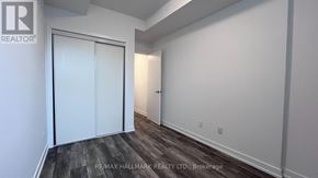 Richmond Hill (Jefferson) townhouse for rent - A room with a white door and a wooden floor.