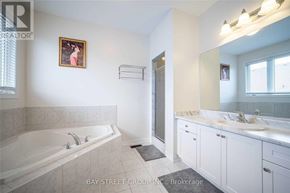 Markham (Berczy) townhouse for rent - A bathroom with a large tub and double sinks.