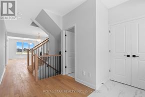 Ottawa apartment for rent - A white interior of a house with a wooden floor and a balcony.